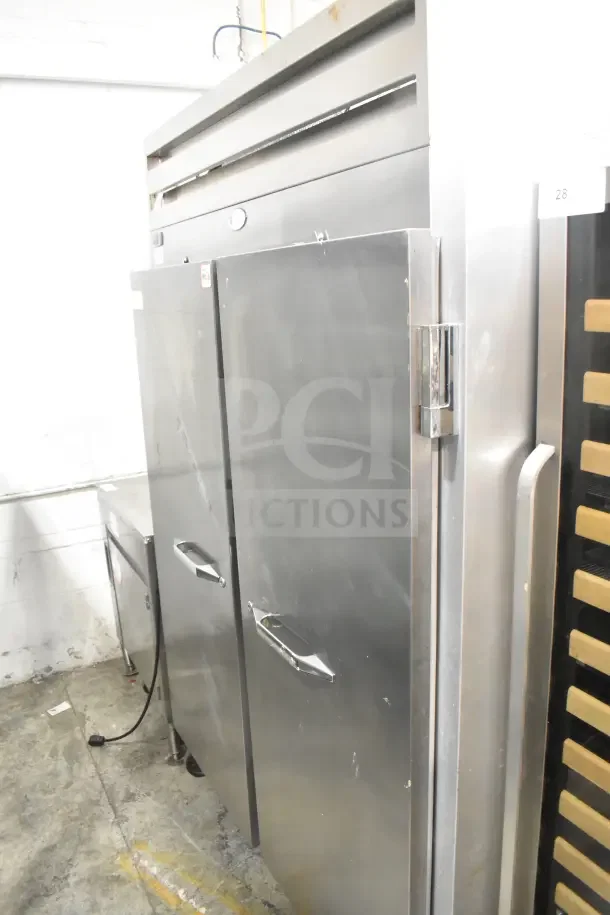 Randell 2020F commercial 2-door reach-in freezer, stainless steel, 115 volts, 1 phase, minor surface wear.