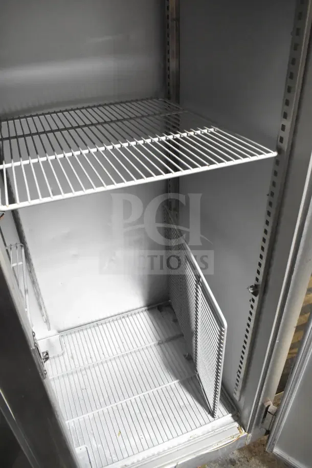 Randell 2020F Commercial 2 Door Reach In Freezer, 115V, 1 Phase, with wire shelves, sturdy metal interior, clean condition.