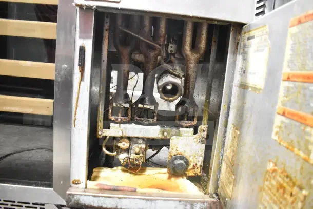 Pitco Frialator 40C commercial gas deep fryer, 105,000 BTU, floor style, showing interior components and labels, used condition.