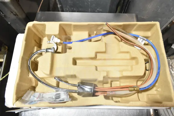 Insinkerator F-GN1100C Instant Hot Water Dispenser in original box, chrome finish, new condition, with installation components.