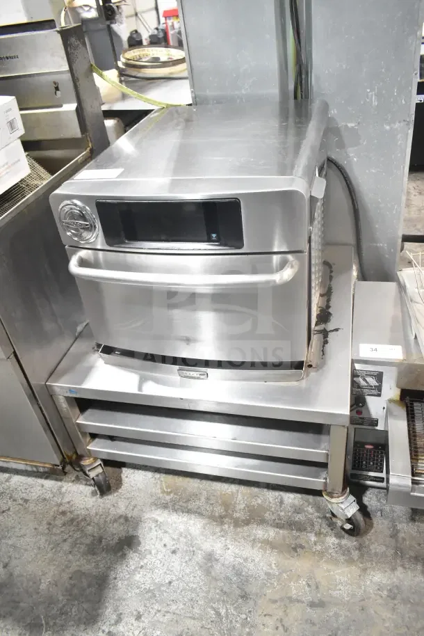 2017 Turbochef Encore 2 rapid cook oven, electric, countertop, stainless steel, on wheeled stand, 208/240V, 1 phase.