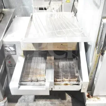 Hatco ITQ-1750-2C dual conveyor toaster with digital controls, stainless steel, used condition, visible caution labels.