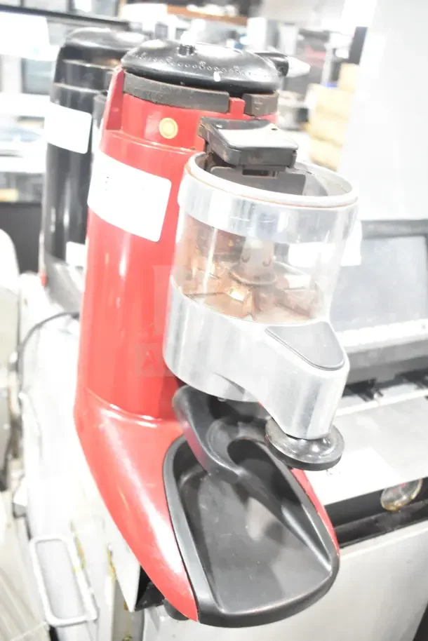 Wega commercial countertop espresso bean grinder base, red, 115 volts, 1 phase. Visible wear, hopper intact.