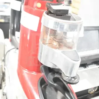 Wega commercial countertop espresso bean grinder base, red, 115 volts, 1 phase. Visible wear, hopper intact.