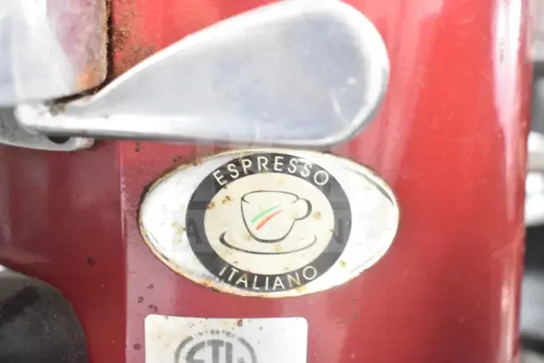 Wega Commercial Countertop Espresso Bean Grinder Base, red finish, visible wear, "Espresso Italiano" badge. 115 Volts, 1 Phase.
