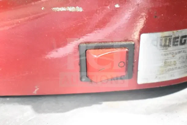 Wega commercial countertop espresso grinder base, red with on/off switch. Visible label indicates 115 volts, 1 phase.