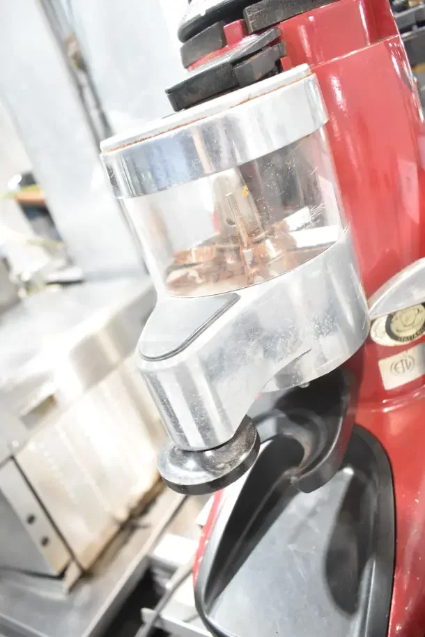Wega Commercial Espresso Bean Grinder, countertop model, red base, 115V, 1 Phase, visible bean hopper, used condition.