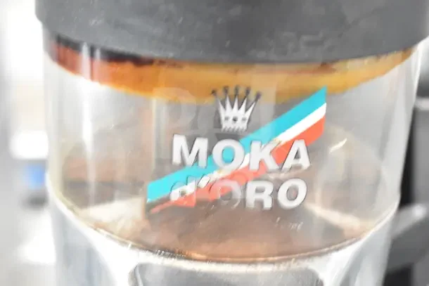 Wega countertop espresso bean grinder base, 110 volts, 1 phase. Features Moka d'Oro branding with crown logo.