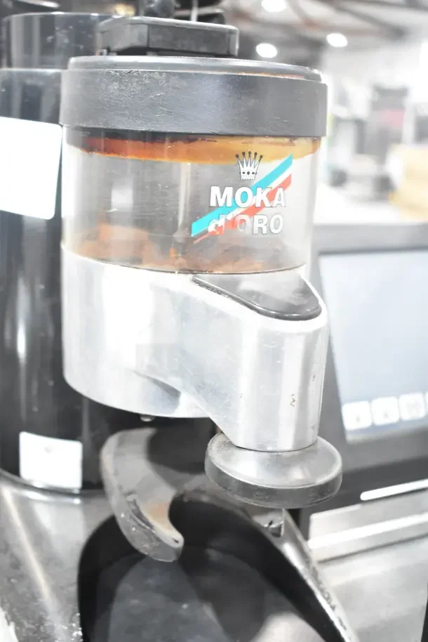 Wega Commercial Espresso Bean Grinder Base, 110V, 1 Phase; metal finish, "Moka d'Oro" label visible. Some signs of use.