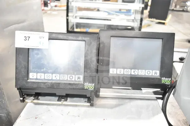Two Ithaca 9700 Transact food prep labelers, touchscreens visible, used condition, ideal for efficient labeling.