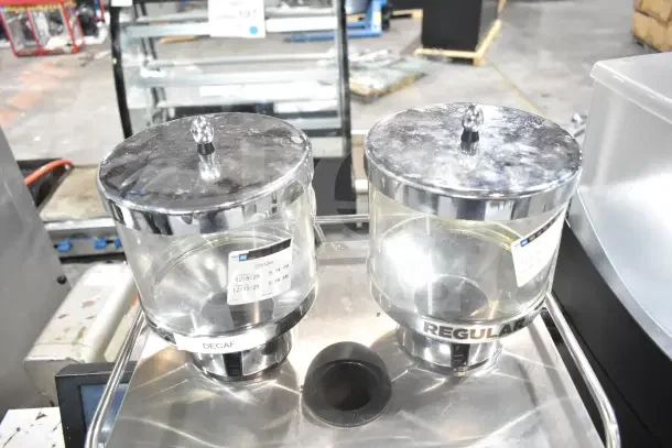 Schaerer SCA1 Coffee Art espresso machine with dual hoppers labeled "DECAF" and "REGULAR," visible tags, good condition.