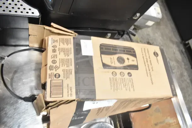 IN ORIGINAL BOX! Insinkerator HWT Instant Hot Water Tank, new, in sealed packaging, features easy installation and compact design.
