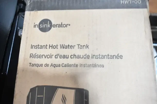 IN ORIGINAL BOX! Insinkerator HWT Instant Hot Water Tank, model HWT-00, new condition. Packaging shows product details.