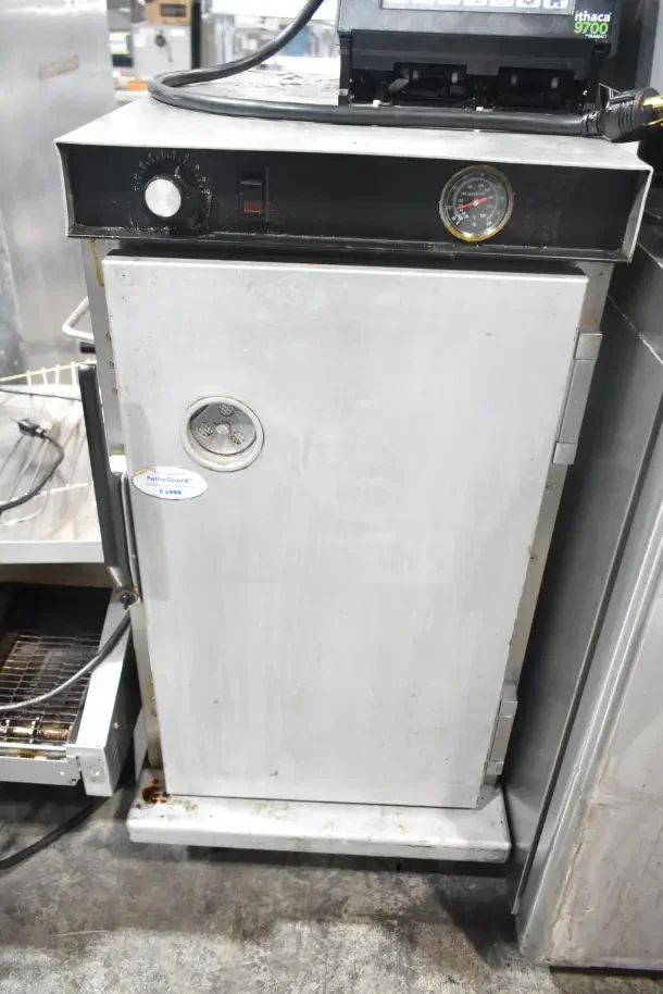 CresCor H33S128C heated holding cabinet on casters, 120V, 1-phase, with temperature dial and Patho-Guard label visible.