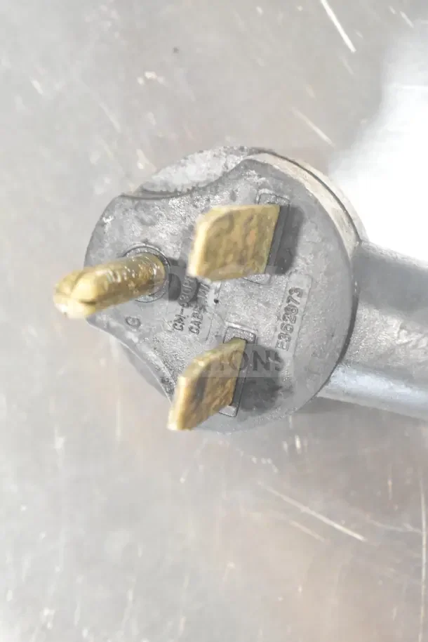 Close-up of a power plug from Turbochef Encore 2 Rapid Cook Oven, showing prongs and electrical markings.