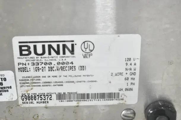 Bunn G9-2T DBC coffee grinder label showing model, voltage, and serial details. Missing lids. 120V, 1 phase.