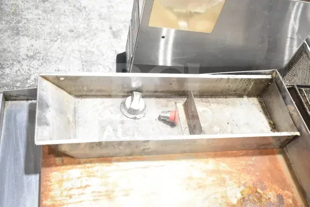 Star Commercial Countertop Flat Top Griddle, shown with thermostatic controls. Griddle surface shows signs of use with rust spots.