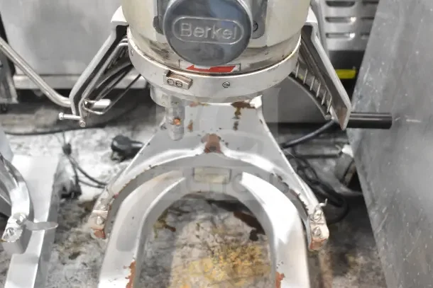 Berkel PM-2B commercial 20 qt. dough mixer with visible wear, rust spots, and bowl guard. 110 volts, 1 phase.