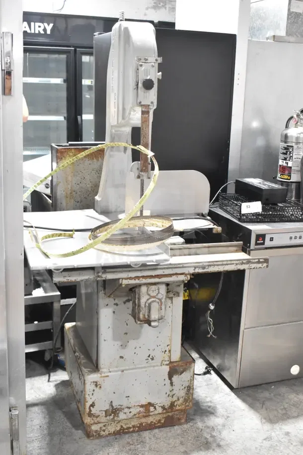 Butcher Boy B14 Commercial Meat Saw, floor style, 220V, 1 phase, shows signs of wear, visible blade, and worktable.