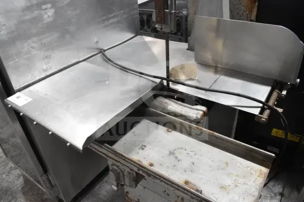 Butcher Boy B14 commercial meat saw, 220V, 1 phase, floor style, used condition, visible wear and rust, "Works Good" tag attached.
