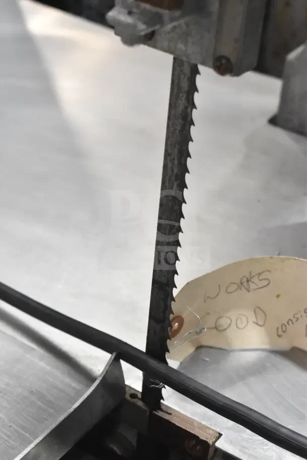 Butcher Boy B14 Commercial Meat Saw, 220V, 1 Phase. Blade and surface shown. Tag reads "WORKS GOOD."