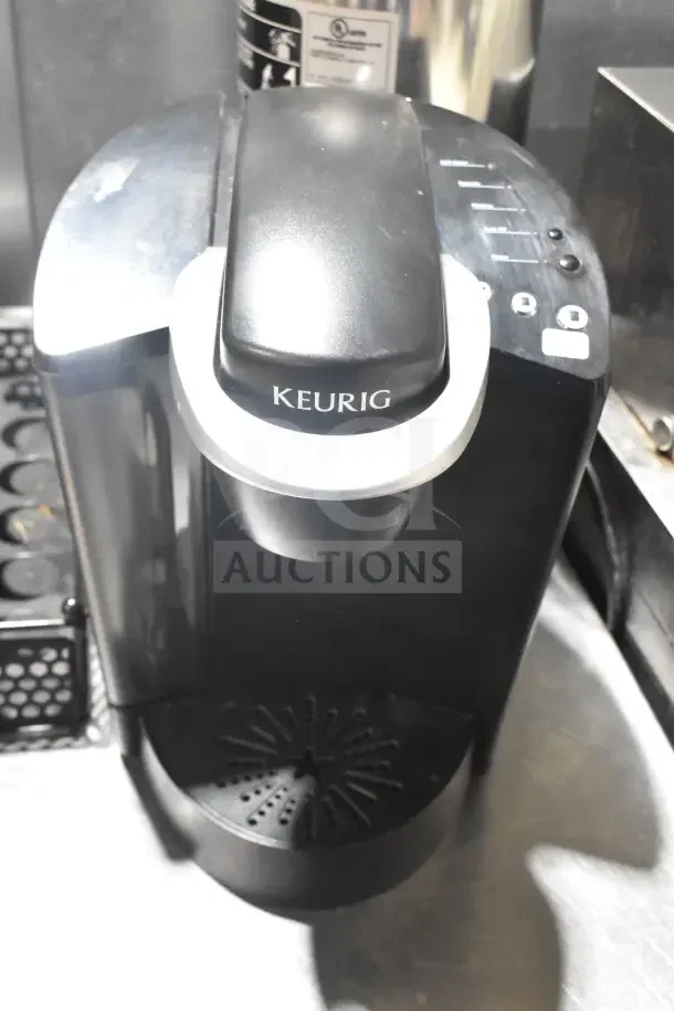Keurig K40 single cup coffee machine with pod holder; gently used condition, includes control panel and drip tray.