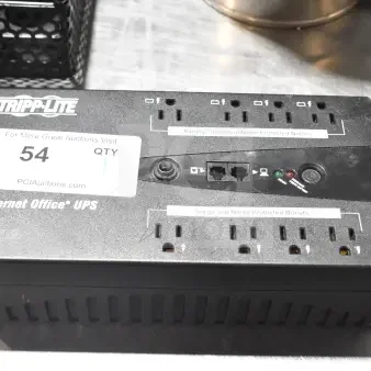 Tripp Lite Internet Office UPS with multiple outlets, surge protection, network ports, and indicator lights. Auction label 54.