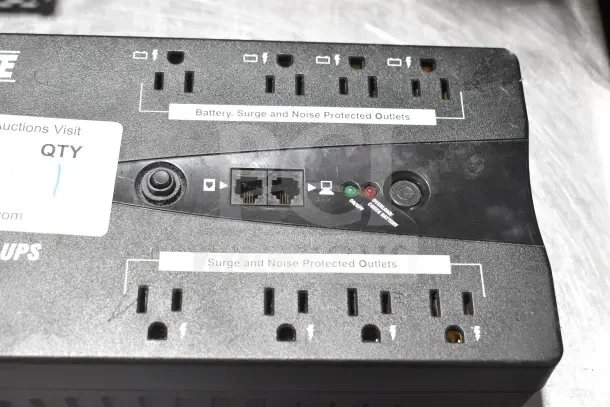 Tripp Lite UPS with battery, surge, and noise-protected outlets; includes status indicators and Ethernet ports; used condition.