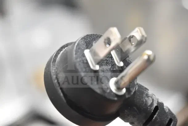 Tripp Lite UPS power cord close-up, showing a three-prong plug in good condition. No visible labels or markings.