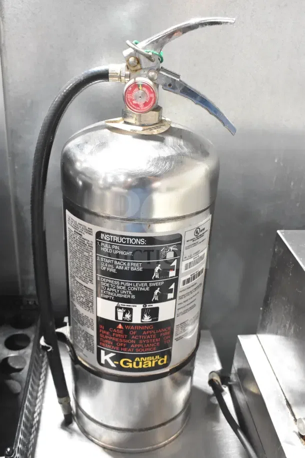 K Guard wet chemical fire extinguisher, stainless steel cylinder, instructions labeled, Ansul brand, local pick-up only.