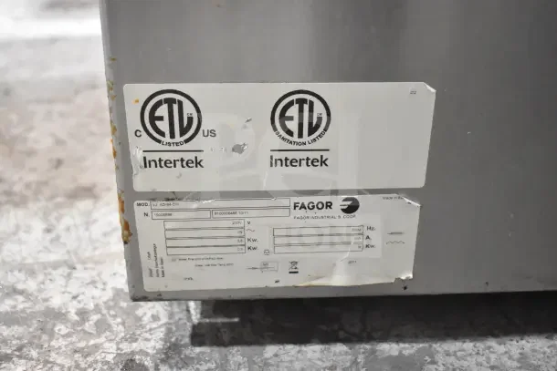 Fagor DJ AD-64 CW commercial dishwasher, 230V, 1 phase, ETL listed, shows labels and slight wear on metal exterior.