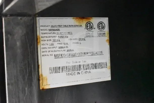 2018 Atosa MSF8304GR commercial salad prep table, 115V, 1 phase, with rust marks, model and serial number labels visible.