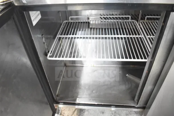 2018 Atosa MSF8304GR commercial sandwich salad prep table interior; stainless steel with wire shelf. 115 volts, 1 phase.