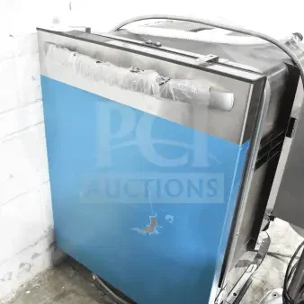 Frigidaire undercounter dishwasher with blue panel, 115 volts, 1 phase. Features protective plastic wrap, slight cosmetic wear.