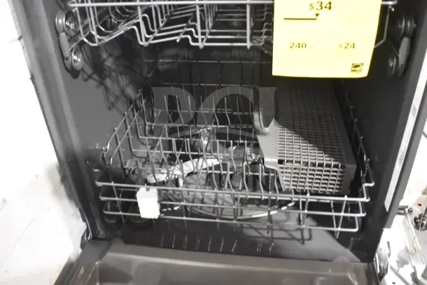 Frigidaire undercounter dishwasher, open view, 115 volts, 1 phase; features dual racks. Yellow tag notes $34 price.
