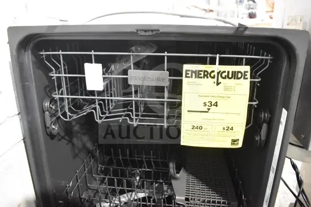 Frigidaire undercounter dishwasher with Energy Guide label, 115 volts, 1 phase. Features include adjustable racks and Frigidaire branding.