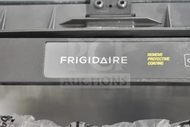 Frigidaire undercounter dishwasher panel, 115 volts, 1 phase, black finish with branding and "Remove Protective Coating" label.