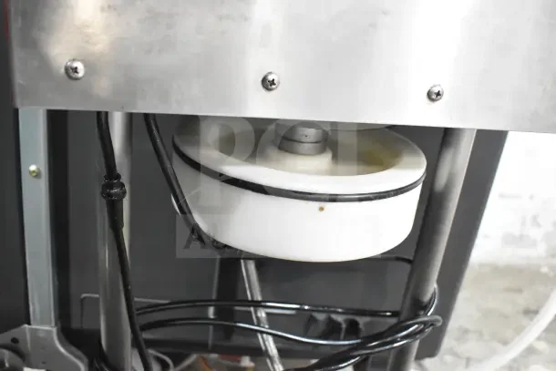 PSV Groupe ST13 Automatic Filling Machine, 220V, 1 Phase, close-up of mechanical components, in working condition.