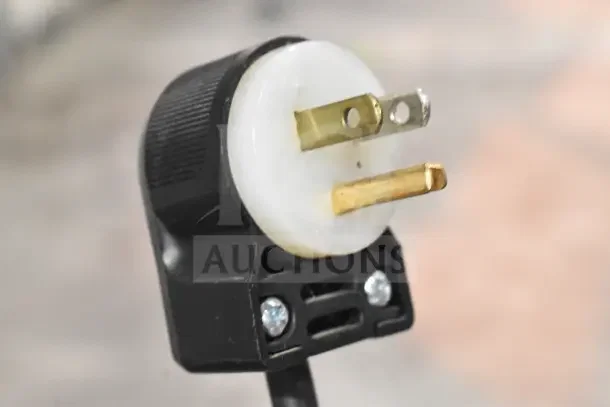 Power plug for Globe 775L Commercial Meat Slicer, 115 volts, 1 phase. Close-up of three-prong plug, in good condition.