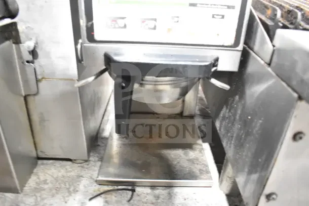 Bunn G9-2T DBC commercial coffee bean grinder, 120V, 1 Phase. Visible wear; stainless steel and black finish.