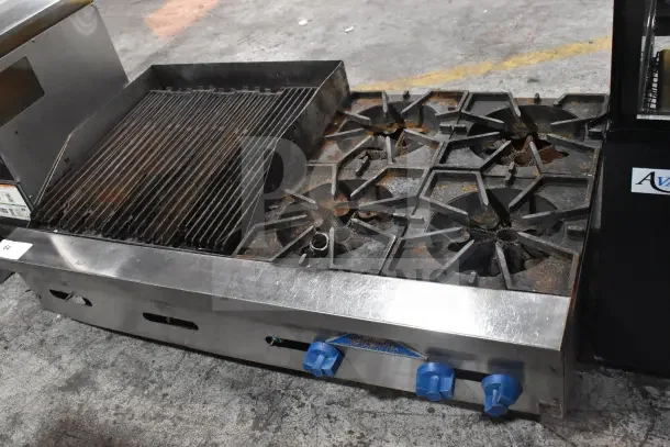 Prince Castle FHP48-2RB commercial charbroiler, natural gas, 4 burners, well-used condition, blue control knobs.
