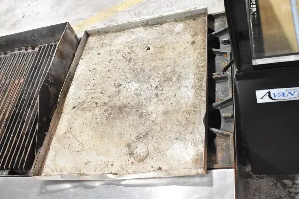 Prince Castle FHP48-2RB commercial countertop charbroiler; natural gas, 4 burners, used, surface wear visible.