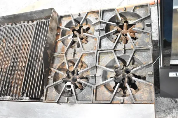 Prince Castle FHP48-2RB charbroiler, 4-burner range, natural gas, countertop model, visible wear, sturdy cast iron grates.