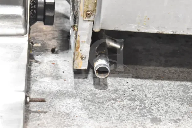 Wells Commercial Griddle, gas-powered, stainless steel, rust spots on exterior, gas connection visible, used condition.
