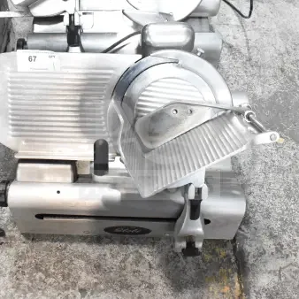 Globe 500L Commercial Countertop Meat Slicer, includes blade sharpener. 120V, used condition, visible model label.