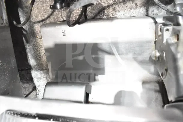 Globe 500L Commercial Meat Slicer, countertop model with blade sharpener, 120V, stainless steel finish, label showing model.