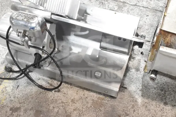 Globe 500 Commercial Meat Slicer with blade sharpener, stainless steel, 115V, visible wear, model number 500 marking.