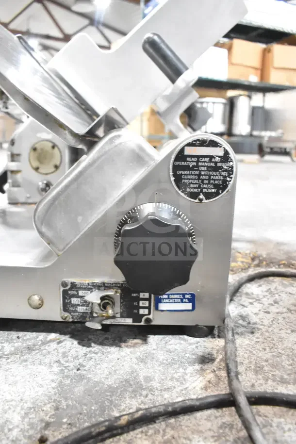 Globe 500 Commercial Meat Slicer with blade sharpener, 115V, 1 phase. Features operation and care labels, slight wear.