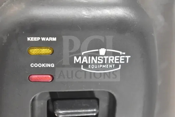 Mainstreet 541RCS60 stainless steel rice cooker, 60 cup capacity. "Keep Warm" and "Cooking" indicator lights visible. Brand new, scratch and dent condition.