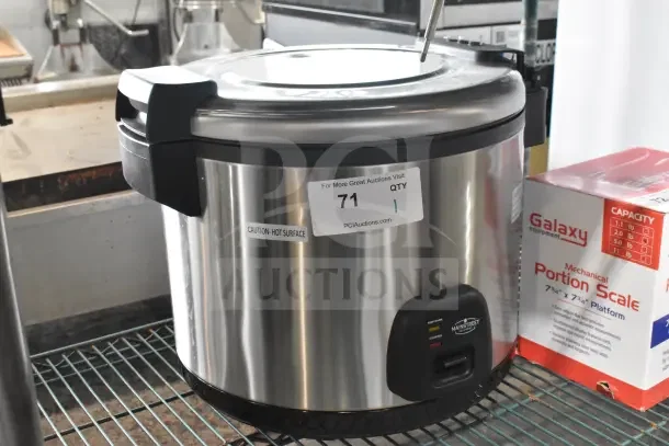 Brand new Mainstreet 541RCS60 stainless steel rice cooker, 60 cup capacity, 120V, with visible caution and auction labels.